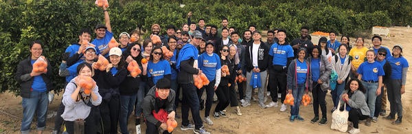 volunteers holding oranges on Martin Luther King Volunteer Day