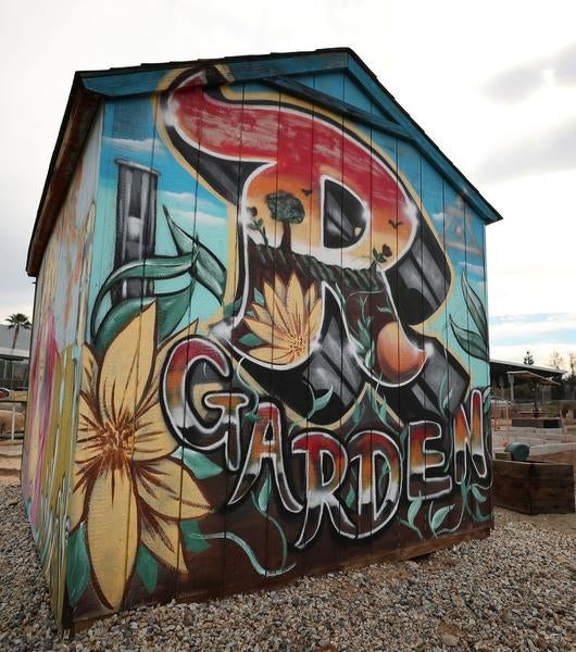 R'Garden Logo on Tool Shed