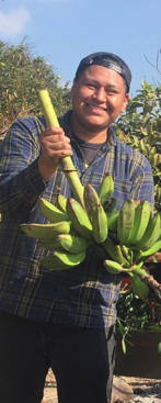 Intern holding Bananas 